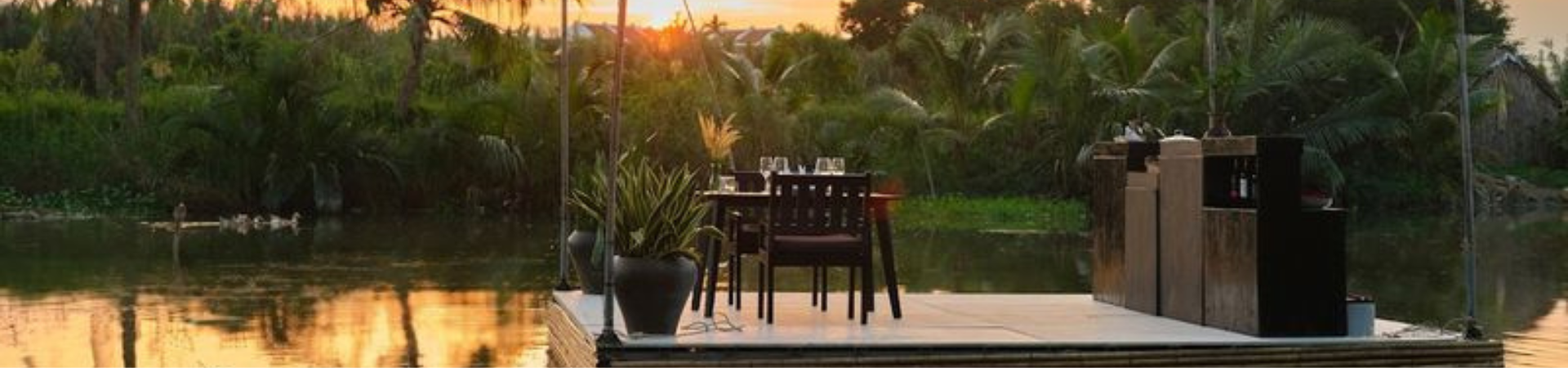 Image of Riverside Serenity: Romantic Dinner on Bamboo Raft