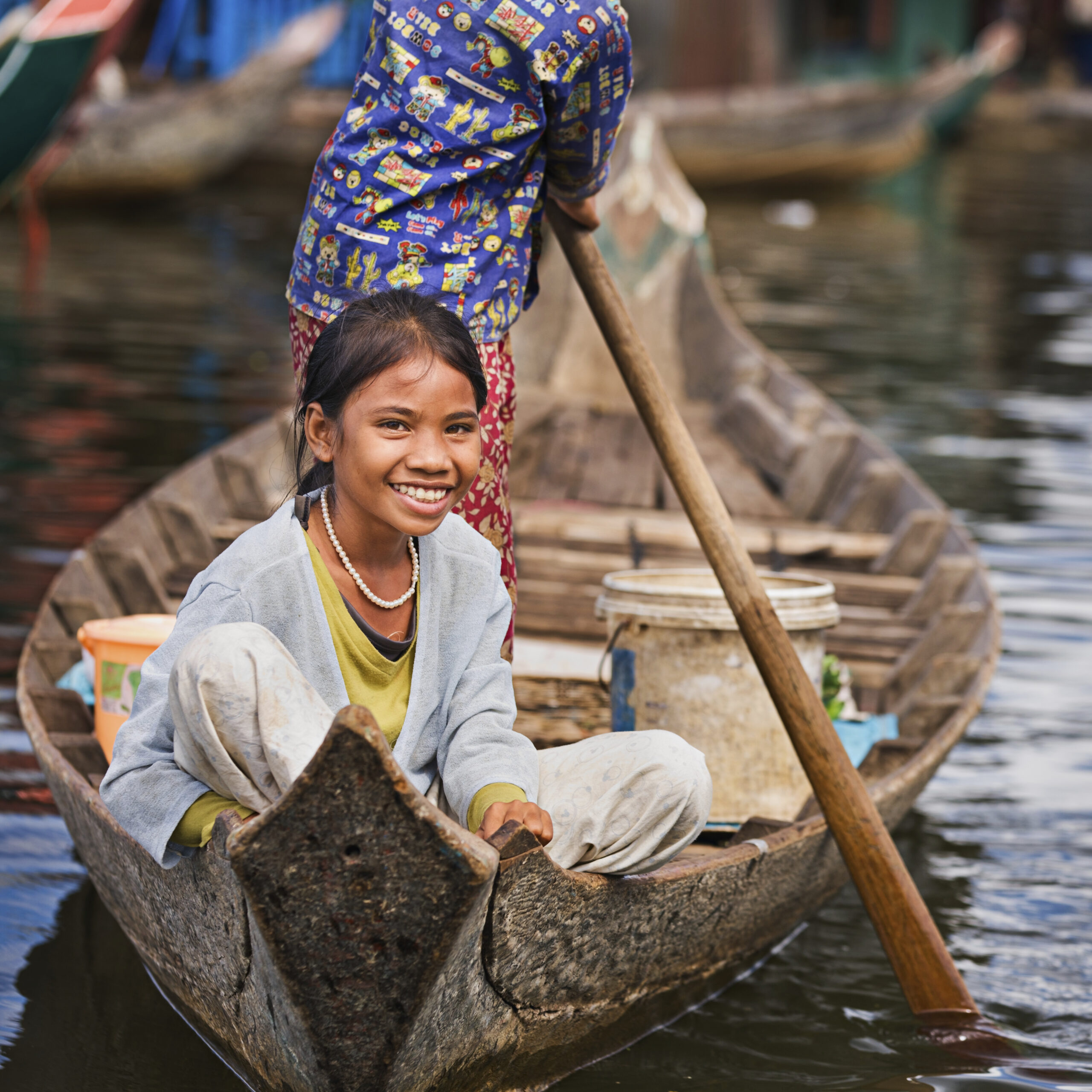 Cambodia - Smiling local on a boat on Tonle Sap Lake