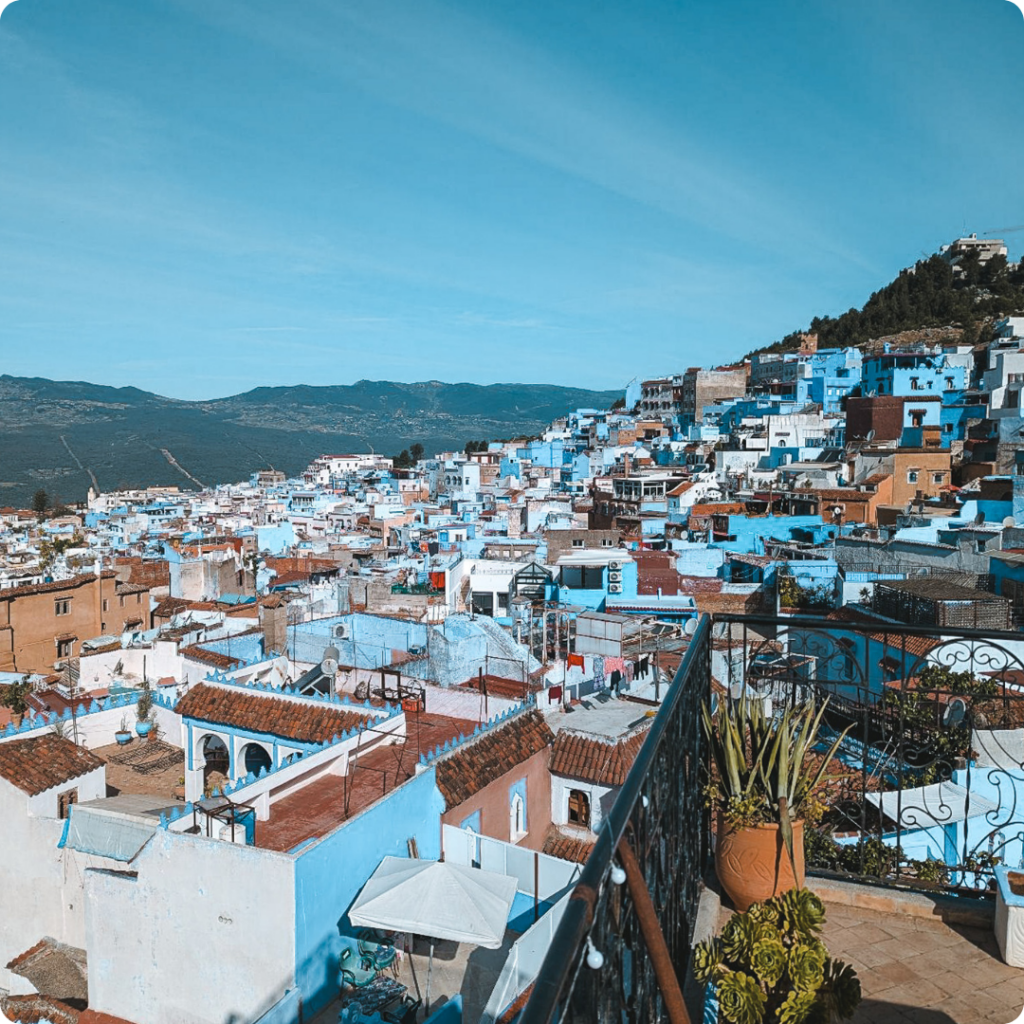 Panoramic view over Chefchaouen, Morocco’s iconic Blue City nestled in the Rif Mountains — a photogenic gem for travel advisors crafting culturally rich and visually striking itineraries beyond Morocco’s main tourist trail.